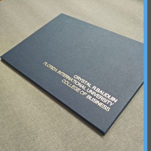 BOOK CLOTH FOLDERS STAMPED WITH GRADUATE'S PERSONAL DETAIL