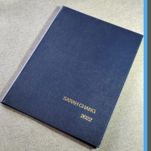 LEATHERETTE FOLDERS STAMPED WITH GRADUATE'S PERSONAL DETAIL